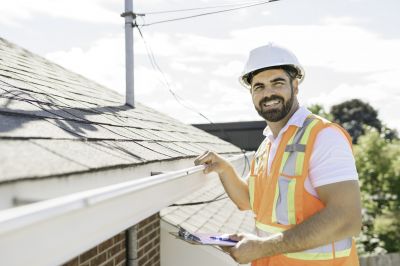 Inspecting a Roof in Fall